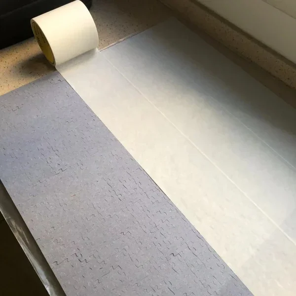 How to Frame a Puzzle: A Step-by-Step Guide 3 Securing a jigsaw puzzle using adhesive tape